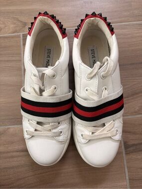 Steve Madden White Sneakers with Red & Black Striped Strap and Black Spikes Used